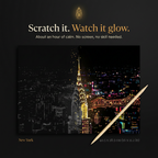 The Scratchlight Evening: scratch it, watch it glow. New York card half revealed with bamboo stylus