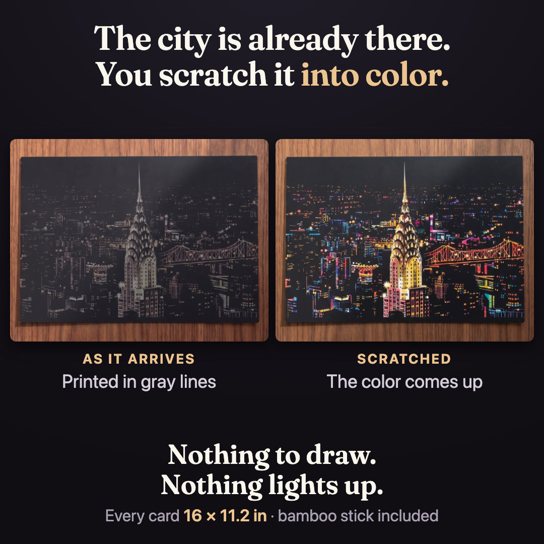 The same New York card twice. As it arrives: the whole city printed in gray lines on black. Scratched: the color comes up. Nothing to draw, nothing lights up. Every card 16 x 11.2 in, bamboo stick included.